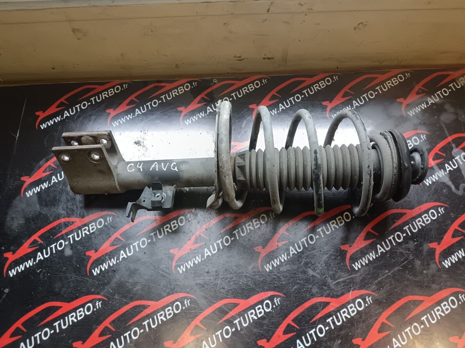 JAMBE DE SUSPENSION AVANT GAUCHE CITROEN C4 1.6VTI 90CH COUPE